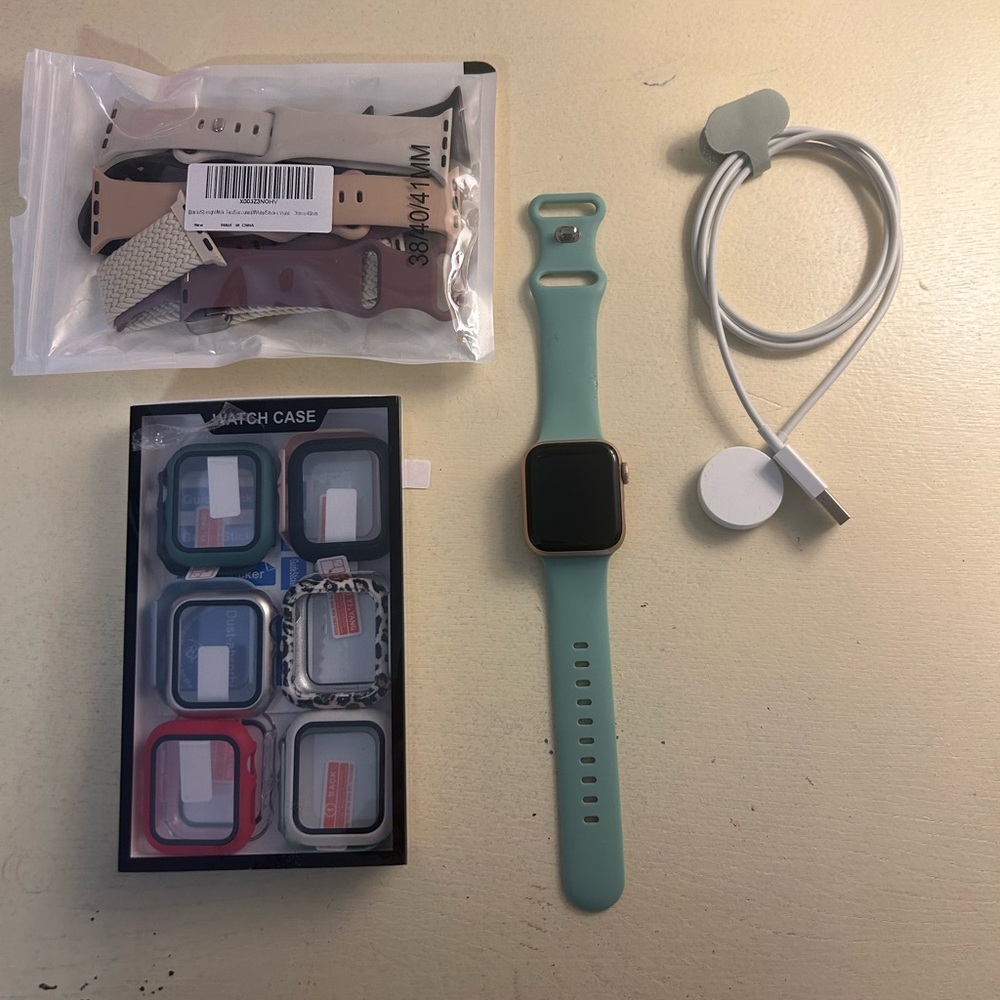 Smartwatch with Mint Green Band and Accessories